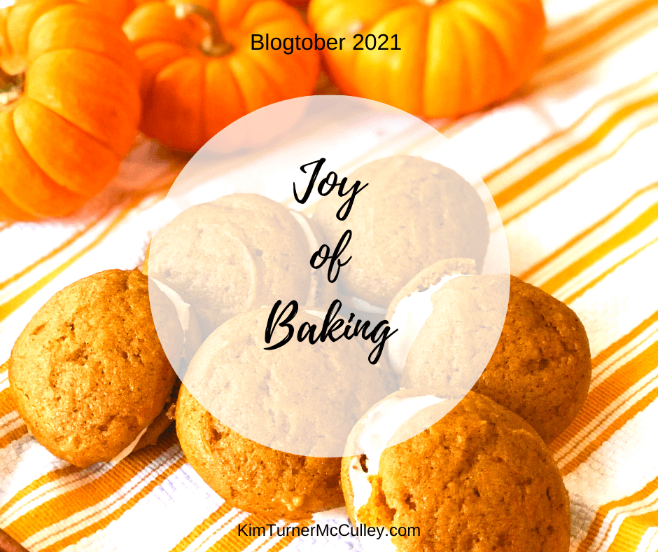 Joy of Baking Blogtober 2021 Joy Journal KimTurnerMcCulley.com Mini pumpkins and Pumpkin Whoopie Pies on an orange and white striped tea towel